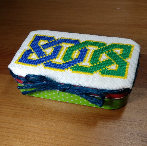 Finished cross-stitch Celtic knot tin topper